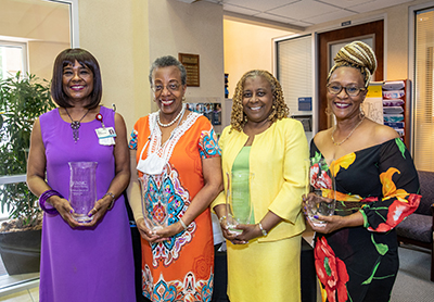 Photo of retirees Dr. LaDonna Northington, Dr. Karen Winters, Dr. Renee Williams and Cheryl Ervin-Jones at a retirement reception in their honor.